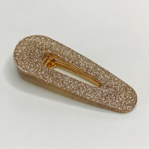 Barrette résine pailletée champagne.