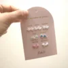 Ensemble de 7 paires de boucles d’oreilles en céramique – Une semaine de poésie Baby. - Image 2