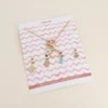 Cartelette CARPEDIEM Collier et 6 pendentifs (soleil oeil en émail et corne).