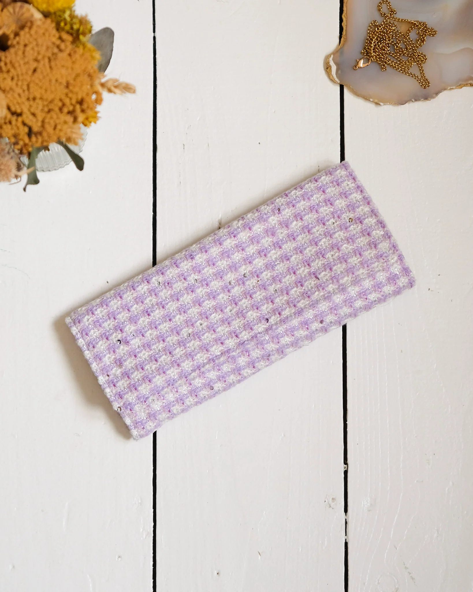 Pochette à bijoux Catherine en pied-de-poule mauve.